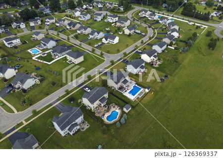 Aerial view of spacious new family houses in upstate New York suburban area. Real estate development in american suburbs Aerial view of spacious new family houses in upstate New York suburban area. Real estate development in american suburbs 126369337