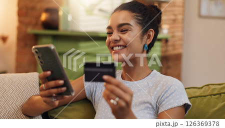Home, credit card and woman on sofa, smartphone and financial transactions with savings, smile and investment. Ecommerce, online shopping or person with internet, cellphone or digital app for banking Home, credit card and woman on sofa, smartphone and financial transactions with savings, smile and investment. Ecommerce, online shopping or person with internet, cellphone or digital app for banking 126369378
