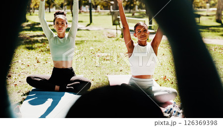 Outdoor, instructor and women with stretching for yoga, holistic exercise and arms balance in portrait. Nature, people and hands of yogi coach for instructions, wellness and mindfulness with fitness 126369398