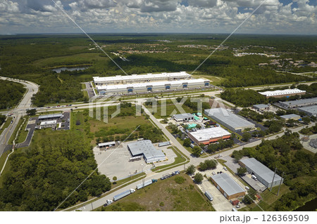 Aerial view of industrial park with goods warehouses and logistics centers in city zone from above Aerial view of industrial park with goods warehouses and logistics centers in city zone from above 126369509