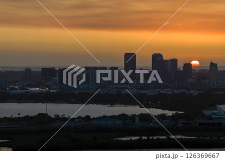 Aerial view of downtown district of Tampa city in Florida, USA at sunset. Dark silhouette of high skyscraper office buildings in modern american midtown Aerial view of downtown district of Tampa city in Florida, USA at sunset. Dark silhouette of high skyscraper office buildings in modern american midtown 126369667