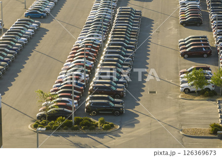 Aerial view of dealership parking lot with many brand new cars for sale. Development of american automotive industry concept 126369673