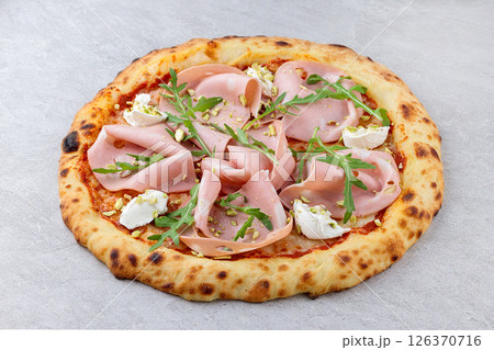 Overhead View of Neapolitan Pizza with Mortadella, Ricotta, Arugula and Pistachios 126370716
