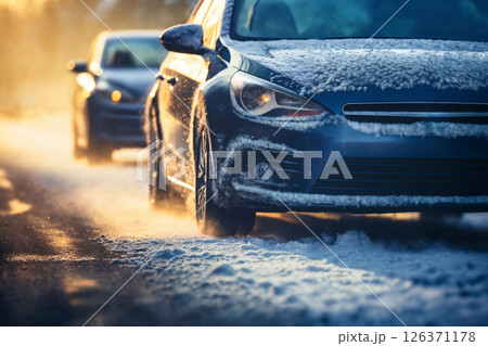 a winter snow covered road, concept of traffic safety on a slippery road 126371178