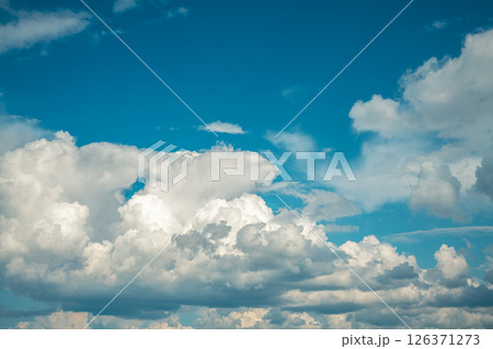 Beautiful cumulus clouds in the blue sky. natural background 126371273