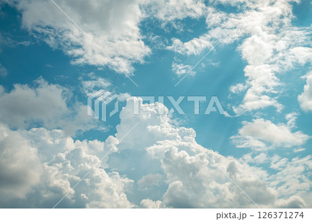 Beautiful cumulus clouds in the blue sky. natural background 126371274