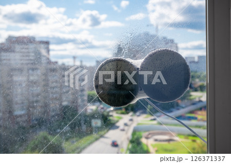 Robot window cleaner washes glass with round rags, robotic service, modern technologies 126371337
