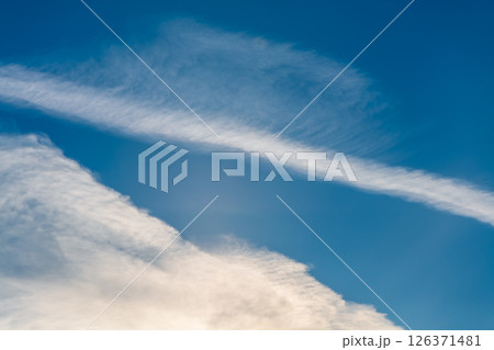 Sky with with cumulus cloud, airplane trail, natural background, celestial landscape, sky background Sky with with cumulus cloud, airplane trail, natural background, celestial landscape, sky background 126371481