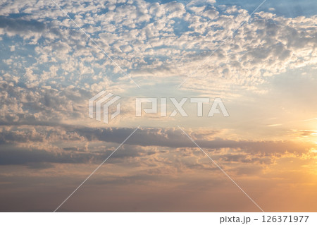Beautiful sunset or sunrise, sky with clouds, sun rays breaking through the clouds, magical, fabulous natural background, serenity and calm Beautiful sunset or sunrise, sky with clouds, sun rays breaking through the clouds, magical, fabulous natural background, serenity and calm 126371977