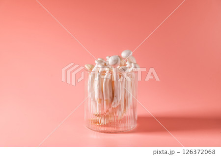 shimeji mushrooms in glass, on pink, peach fuzz background shimeji mushrooms in glass, on pink, peach fuzz background 126372068