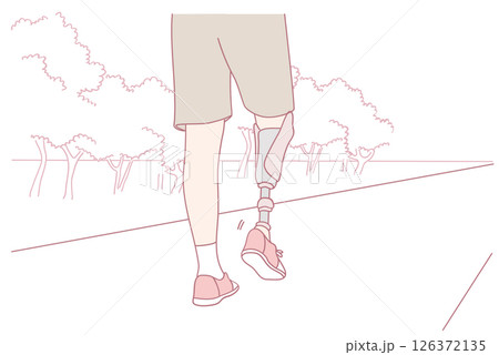 A person confidently walking through the beautiful nature landscape with a prosthetic leg 126372135