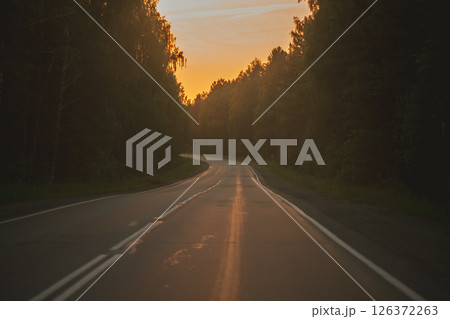 The asphalt road goes into the distance On the Sunset 126372263