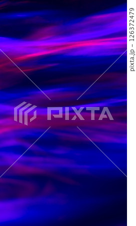Defocused abstract red, pink and blue background of speed camera movement over glowing lights. A pattern of flashes of light similar to the northern lights Defocused abstract red, pink and blue background of speed camera movement over glowing lights. A pattern of flashes of light similar to the northern lights 126372479