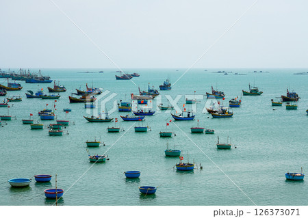 Many small fishing vessels and boats on the coast of the South China Sea in Mui Ne, Vietnam 126373071