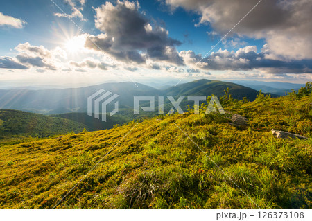 carpathian mountain landscape in evening light. view in to the distant valley from lush green hills. sunset sky with clouds carpathian mountain landscape in evening light. view in to the distant valley from lush green hills. sunset sky with clouds 126373108