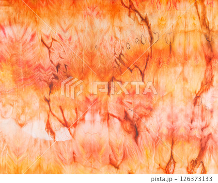 abstract pattern on silk fabric texture in yellow and brown tones abstract pattern on silk fabric texture in yellow and brown tones 126373133