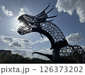 Fierce Metal Dragon Sculpture Biting Toward the Sun 126373202