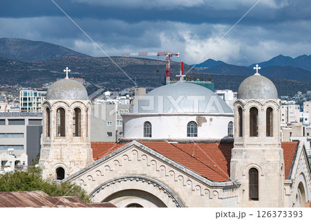 Holy Trinity church with a red tile roof and white stucco walls stands in the middle of Limassol Old Town, Cyprus 126373393