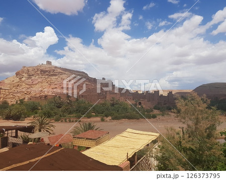 A small town in a vast desert, surrounded by beautiful mountains A small town in a vast desert, surrounded by beautiful mountains 126373795