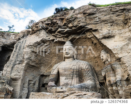 Giant Buddha in Yungang grottoes, ancient buddhist temple in Datong, Shanxi province, China Giant Buddha in Yungang grottoes, ancient buddhist temple in Datong, Shanxi province, China 126374368