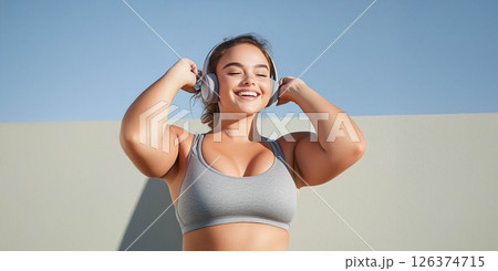 Plus size woman focused on training with battle ropes in the gym, showcasing strength and determination. Generated image Plus size woman focused on training with battle ropes in the gym, showcasing strength and determination. Generated image 126374715