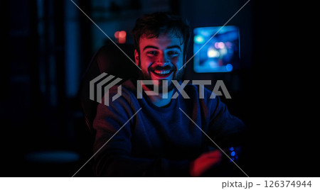 Young Gamer Celebrating Victory with a Joyful Victory Pose.Generated image 126374944