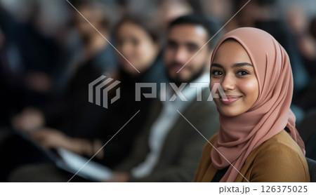 Empowering Diversity: Professionals Engaged at a Business Conference with a Smiling Muslim Woman in the Audience. Generated image 126375025