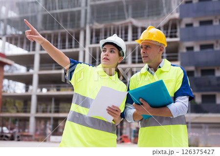 Engineers discussing in construction plant Engineers discussing in construction plant 126375427