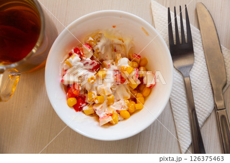 Salad with corn, pepper, crab, cheese and sour cream. Russian cuisine Salad with corn, pepper, crab, cheese and sour cream. Russian cuisine 126375463
