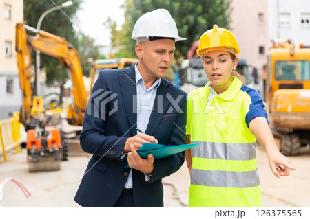Engineers discussing in construction plant 126375565
