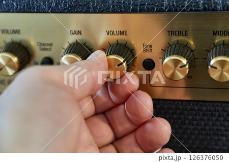 Guitar amplifier closeup, cable connected 126376050