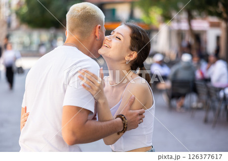 Friends met after long separation, greet and hug Friends met after long separation, greet and hug 126377617