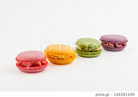 Colorful macarons displayed on a white background Colorful macarons displayed on a white background 126381109