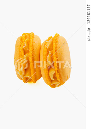 Delicious yellow macarons filled with buttercream 126381137