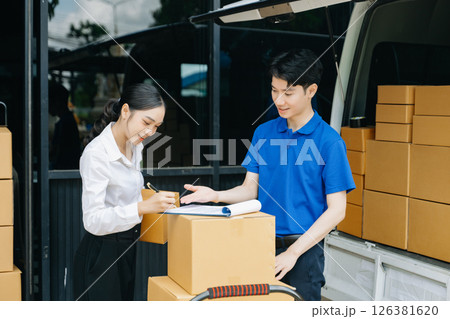 Express Delivery Service. Asian Courier Delivering Package to man Delivery service near van outside the warehouse, delivery home Express Delivery Service. Asian Courier Delivering Package to man Delivery service near van outside the warehouse, delivery home 126381620