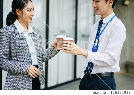 Businessman and woman going in city center in smart casual business style, talking, working together, stylish freelance people Businessman and woman going in city center in smart casual business style, talking, working together, stylish freelance people 126381938