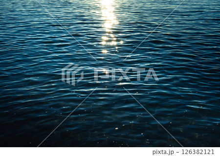 Dark ocean in early morning, dark blue waves with reflection,Backgrounds or marine themes 126382121