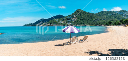 Tropical beach and sea with fresh summer sky on Koh Samui. Beach chairs and umbrellas. Seaside vacation. Summer getaway. 126382128