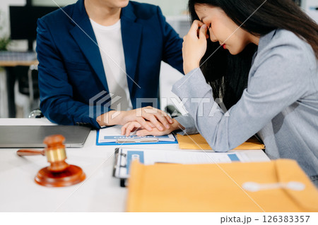 Judge gavel with scales of justice, Business and lawyer or counselor consulting and discussing contract papers Judge gavel with scales of justice, Business and lawyer or counselor consulting and discussing contract papers 126383357