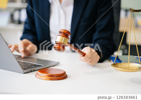 Justice and law concept.Male judge in a courtroom on white table and Counselor or Male lawyer working 126383661