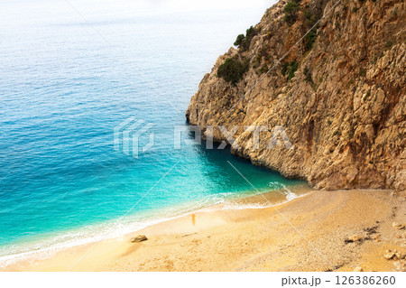 Top view of beautiful blue sea water with sand beach among mount 126386260
