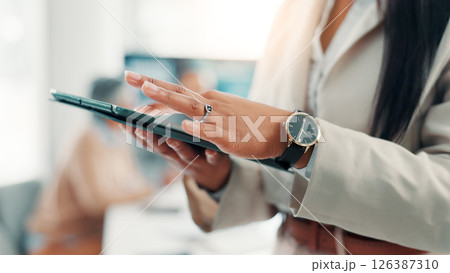 Business, hands and tablet with person in office for corporate research or online planning. App, development and information with employee in professional workplace to connect or scroll for update 126387310