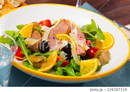 Plate of tasty salad with baked duck breast 126387319