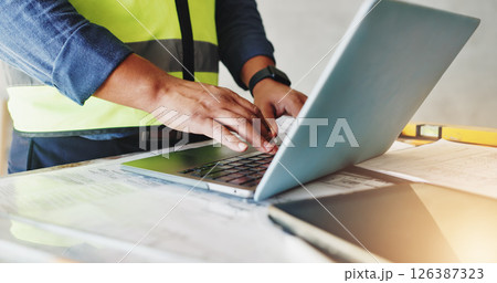 Man, laptop and hands with inspection for construction, blueprint and building renovation of development. Engineer, technology and project management for maintenance with infrastructure floor plan 126387323