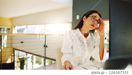 Remote work, woman and computer in home with headache, internet error and frustrated with mistake. Mature entrepreneur, glasses and reading at tech for problem solving, tension and business challenge 126387331