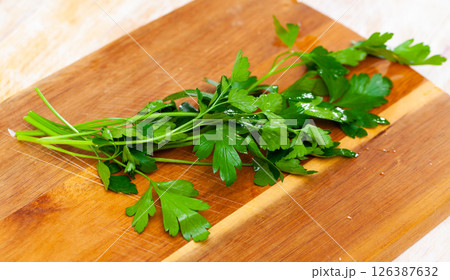 Fresh parsley on a wooden surface Fresh parsley on a wooden surface 126387632