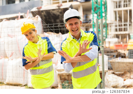 Builders dancing in construction site 126387834