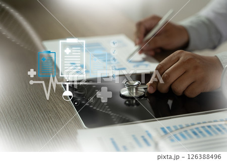 Professional analyzing medical reports healthcare professional uses tablet with digital medical icons and documents, symbolizing modern medical 126388496
