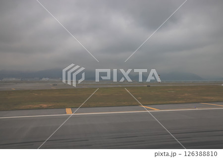 March 29 2025 Foggy Airport Scene with Airplanes and Terminal Under Overcast March 29 2025 Foggy Airport Scene with Airplanes and Terminal Under Overcast 126388810