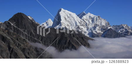 A glimpse of Ama Dablam, Cholatse and Tobuche. A glimpse of Ama Dablam, Cholatse and Tobuche. 126388923